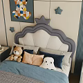 Cozy Kids Bed with Crown Headboard Colorful Wall Art Star Decorations and Stuffed Toys