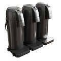 Three Modern Black Kitchenware Cylindrical Containers With Lids And Base Stands