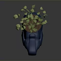 Green Leafy Plant in Blue Elephant Shaped Planter with Fresh Green Foliage