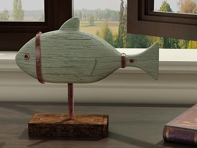 Light Green Wooden Fish Shaped Ornament with Brown Straps Wooden Base and Book on Windowsill 3d model