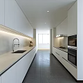 Modern Kitchen Interior With White Cabinets Light Countertops Appliances And Natural Lighting