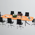 Wooden Conference Table Surrounded By Black Office Chairs With Potted Plants Pink Flowers And Documents