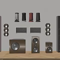 Various Types of Audio Speakers in Different Sizes Colors Displayed on Grey Background Wooden Floor