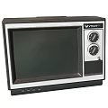 Vintage Televisions With Silver Frame Black Screen And Wooden Case Design