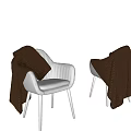 White Upholstered Leisure Chairs With Wooden Legs And Knitted Blankets In Minimalist Grey Room