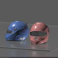 Two Glossy Blue And Pink Motorcycle Racing Helmets With Visors On Gray Surface