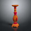 Decorative Orange And Pink Candle Holder With Carved Details And Ornate Base