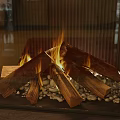 Modern Fireplace With Burning Logs Flames And Decorative Pebbles In Interior