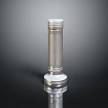 Silver Metal Cylindrical Equipment With Textured Surface Reflective Base And Dark Background