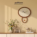 Modern Round Wooden Wall Clock With White Dial Colorful Hands And Pendulum On Beige Wall