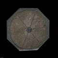 Octagonal Stone Manhole Cover With Circular Metal Center Brick Edges And Moss