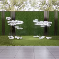 White Cloud Like Sculptures in Garden with Green Vertical Wall and Stone Pavement