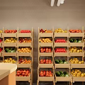 Fresh Fruit Store Interior Featuring Various Fruits on Shelves and Customers Selecting Produce