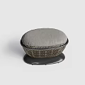 Round Woven Ottoman With Gray Cushion And Black Base Modern Design