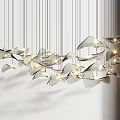 Modern Chandelier with Multiple Leaf Shaped Metallic Pieces and Illuminated Warm Glow for Contemporary Interiors