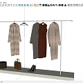 Stylish Clothes Hanging On Rack With Brown Bags And High Heels