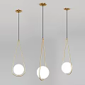 Modern Three Chandeliers With Gold Frame Black Hanging Cords And White Spherical Lamps