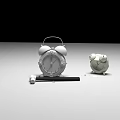 Silver Alarm Clock And White Cartoon Clock With Pen And Cap