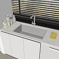Modern Kitchen Sink With Chrome Faucet White Cabinets And Glass Jars On Countertop