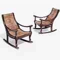 Two Classic Wooden Rocking Chairs With Wicker Seats And Curved Legs