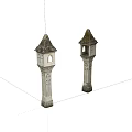 Pair of Decorative Stone Towers With Carved Details And Pointed Roofs