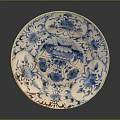 Blue and White Porcelain Plate Adorned With Floral Plant Patterns And Detailed Designs