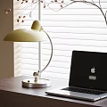 Yellow Shade Desk Lamp With Silver Stand On Wooden Desk Near Laptop And White Blinds