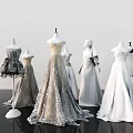 Fashion Mannequins Displaying Elegant Gray And White Dresses In Various Styles