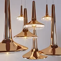 Modern Copper Chandelier Design With Flared Transparent Shades And Warm Lighting