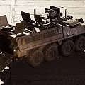 Military Utility Vehicle With Desert Camouflage Multi Wheeled Design Roof Mounted Weapons And Sensors