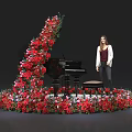 Floral Installation Surrounding Black Piano With Red And Pink Flowers And Woman Standing By