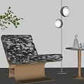 Stylish Black White Patterned Lounge Chair With Round Side Table Gold Floor Lamp Green Plant