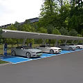 Covered Parking Lot With Electric Cars Charging Stations And Blue Spaces Surrounded By Trees