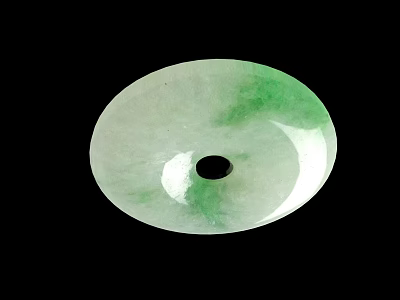 Round Green And White Jade Pendant With Central Black Hole On Black Background 3d model