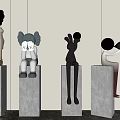 Modern Artistic Sculptures Displayed on Concrete Pedestals with Diverse Figurine Designs