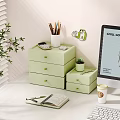 Organized Desk With Green Storage Drawers Colored Pencils Notebook And Potted Plant
