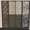 Various Colorful Patterned Fabric Samples Arranged On Display Shelf