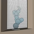 Decorative Blue Transparent Spheres Sculpture Placed By Window With White Blinds