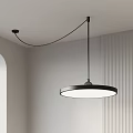 Modern Round Pendant Light With Black Metal Frame And White Lampshade In Minimalist Interior