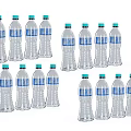 Beverage in Transparent Plastic Bottles with Blue Labels and Green Caps Neatly Arranged in Groups