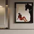 Black Framed Wall Art With Person In Orange Black Horse Sculpture And Pendant Light Candles