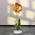 Elegant Floral Display with Orange Yellow Flower Green Leaves and White Pebble Base