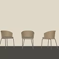 Three Modern Woven Dining Chairs With Black Metal Legs In Light Room
