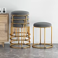 Modern Gray Cushioned Stools With Gold Metal Frame Round Marble Table And Marble Wall Backdrop 3d model