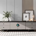 Modern TV Stand With Gray Drawers Black Countertop Circular Decor Green Plant And Decorative Frames