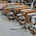 Old Abandoned Trucks Stacked In Dilapidated Ruins With Scattered Rusty Wreckage