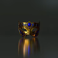 Ornate Golden Mask With Blue Gemstone Intricate Decorative Patterns And Classic Design