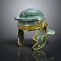 Ancient Decorative Helmet With Green And Gold Finish Ornate Cheek Guards And Riveted Details