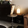 Round Metal Base Side Table With Lamp Books And Glass On Living Room Floor