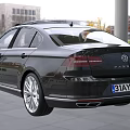 Sleek Black Volkswagen Sedan With Roof Spoiler Modern Front And LED Headlights